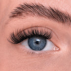 Close-up of a blue eye with long eyelashes